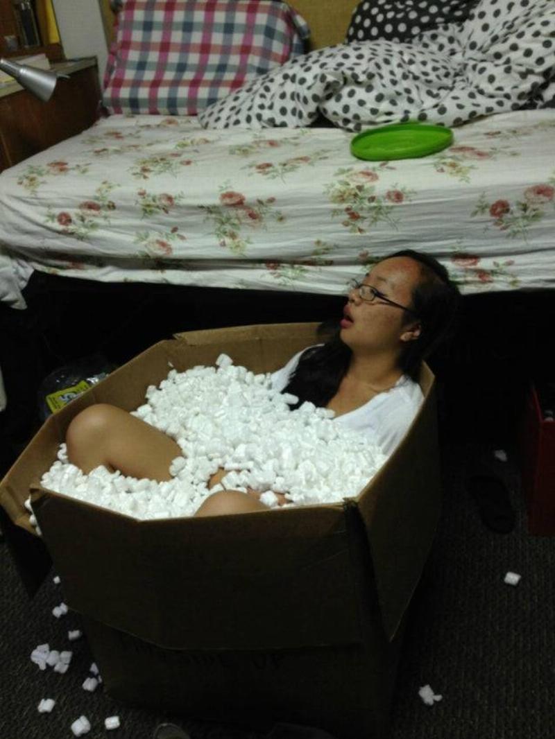 woman fell asleep in a box of packing peanuts