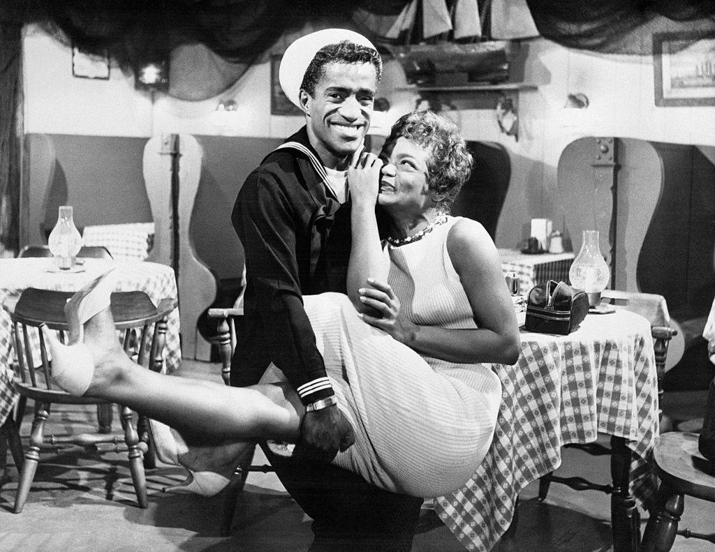 Singer Eartha Kitt clowns with singer Sammy Davis, Jr.,