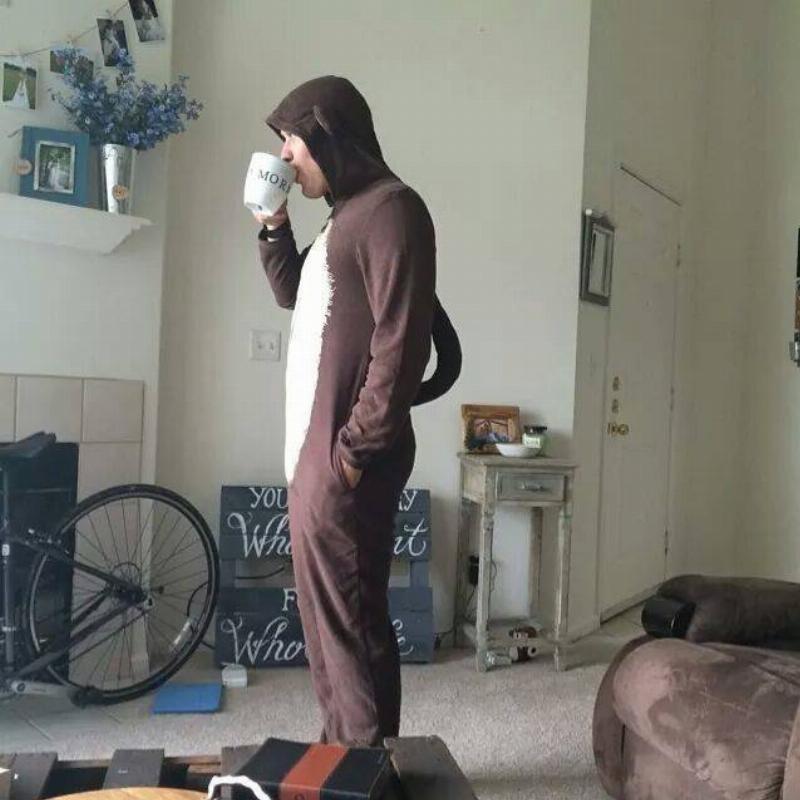 husband dressed up as a monkey sipping tea