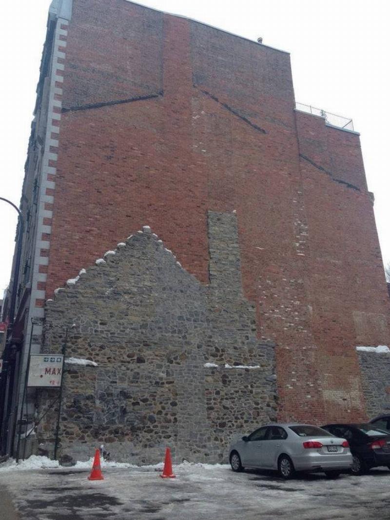 two buildings built around each other 