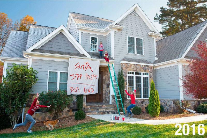santa stop kids on roof with sign