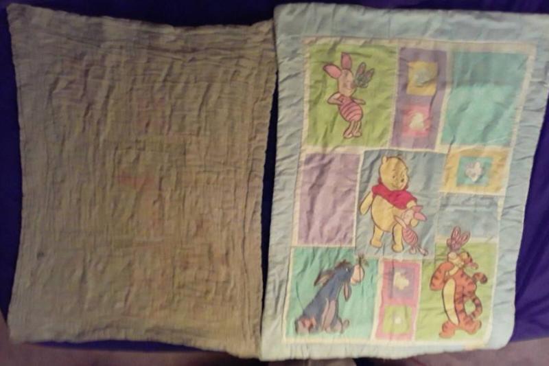 new winnie the pooh quilt next to old quilt that's faded
