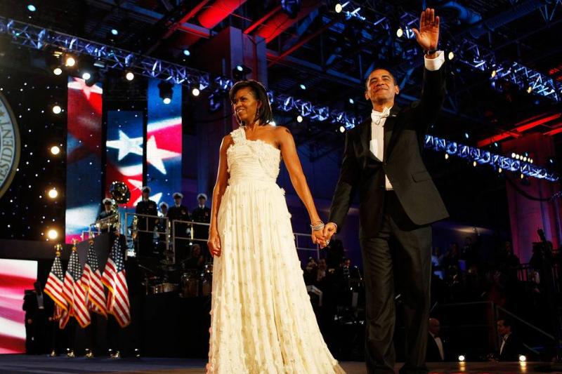 Michelle inaugural ball - 84391177 First Lady Michelle Obama waves at the 2009 Inaugural Ball.
