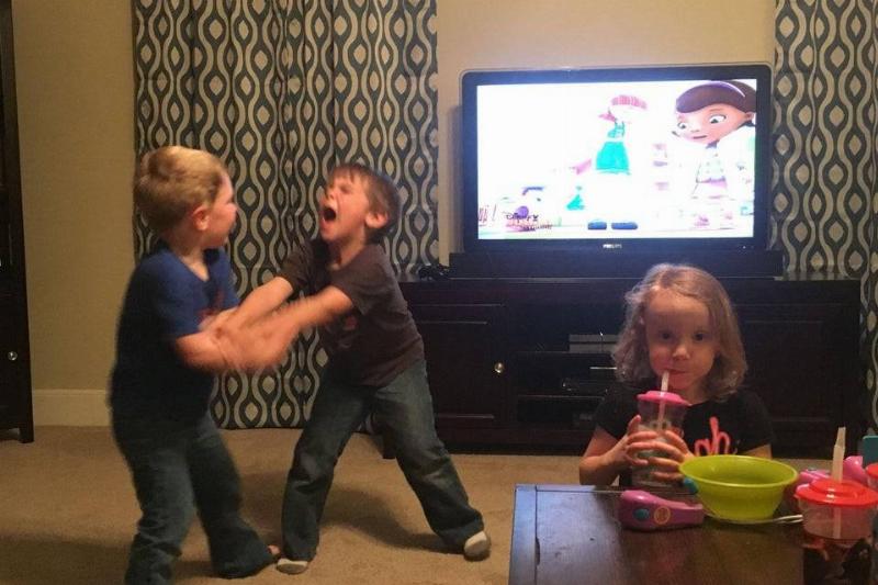 Children fighting in living