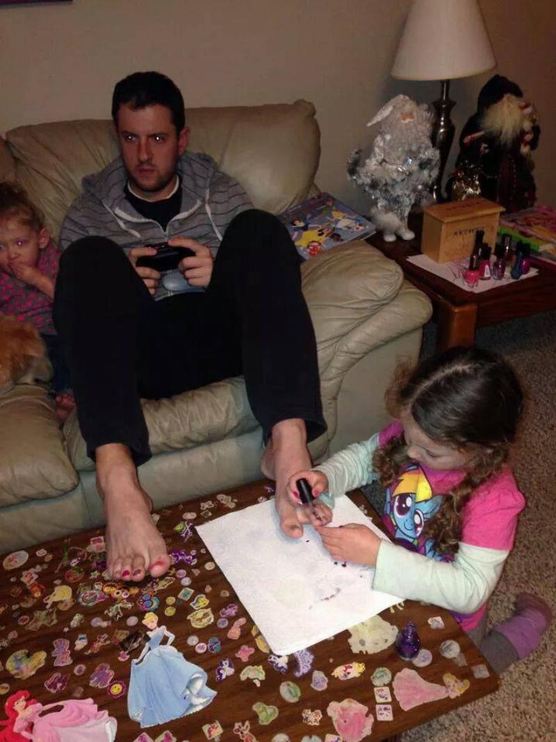dad life playing videos games with painted nails