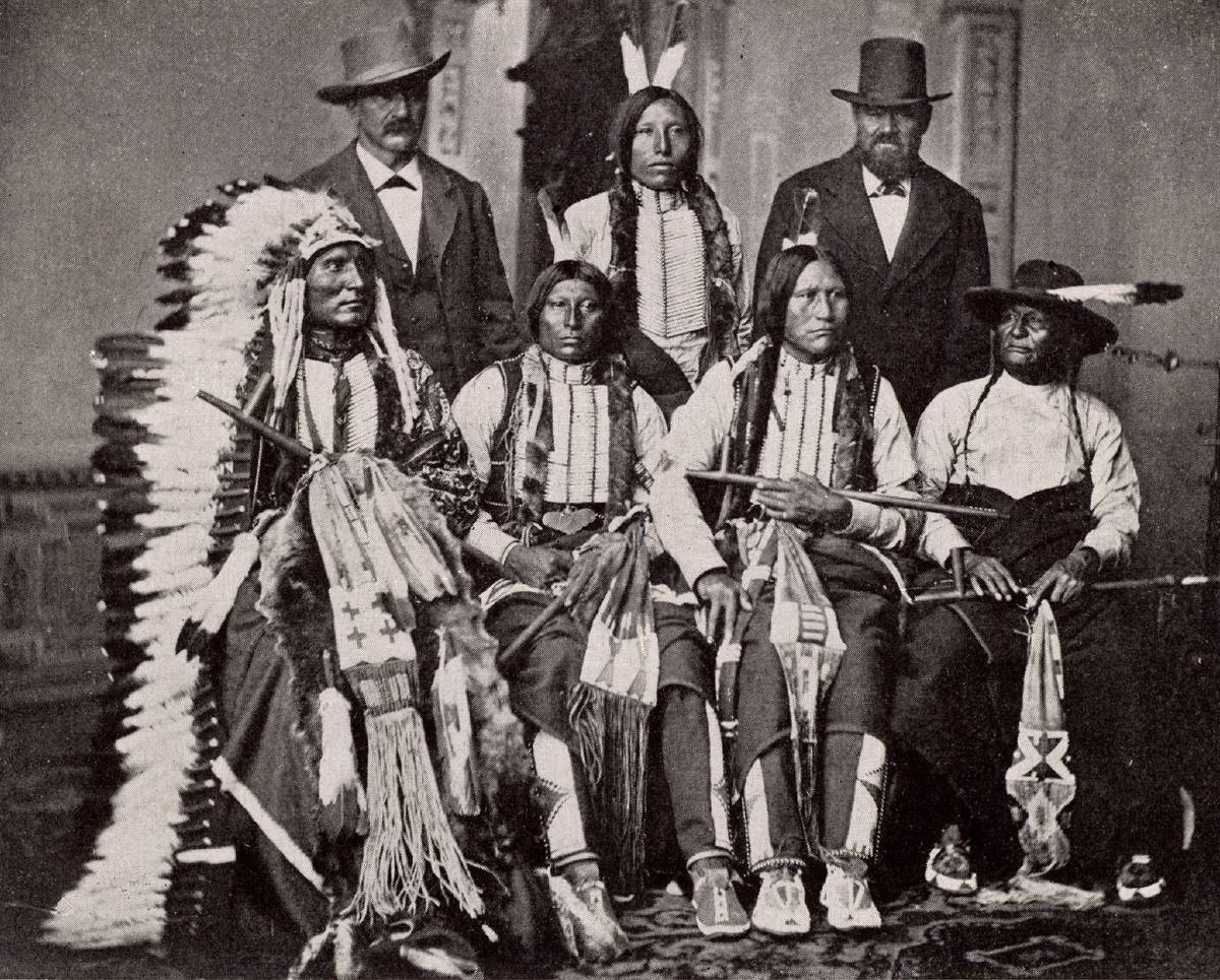 Sioux chiefs pose for a photo with representatives at the White House.