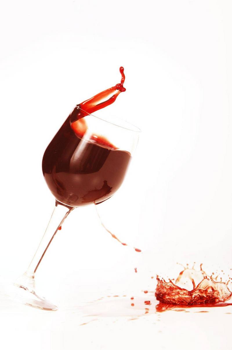 A glass of red wine spilling onto a table, 21 January 2004. AFR Picture by LOUI