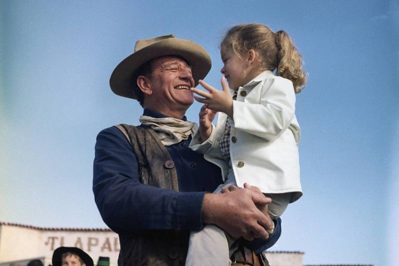 John Wayne and Daughter Aissa on Movie Set
