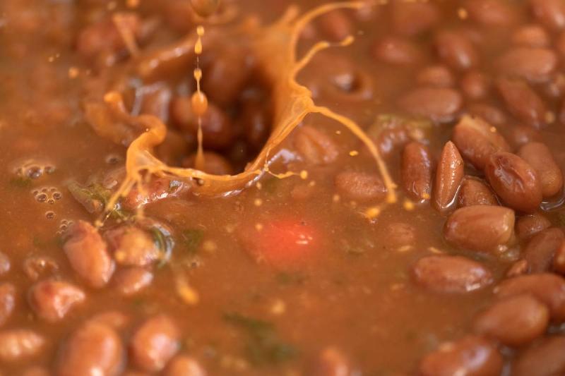 Red kidney beans soup with small splashes of grains falling... Red kidney beans soup with small splashes of grains falling...
