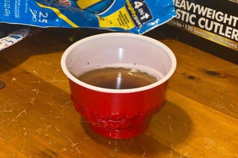 melted red solo cup full of grease