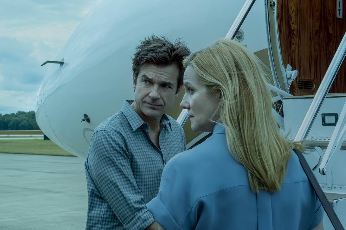 man and woman outside a plane in ozark