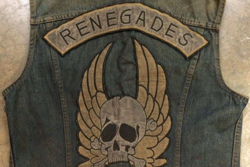 renegades jacket A denim vest has the Renegades logo and insignia ironed onto the back.