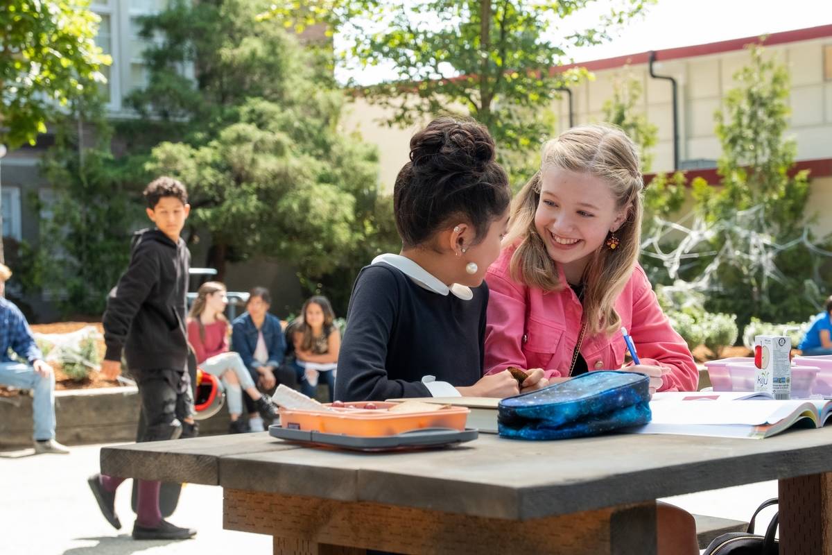 two girls eating lunch outside in the baby-sitters club