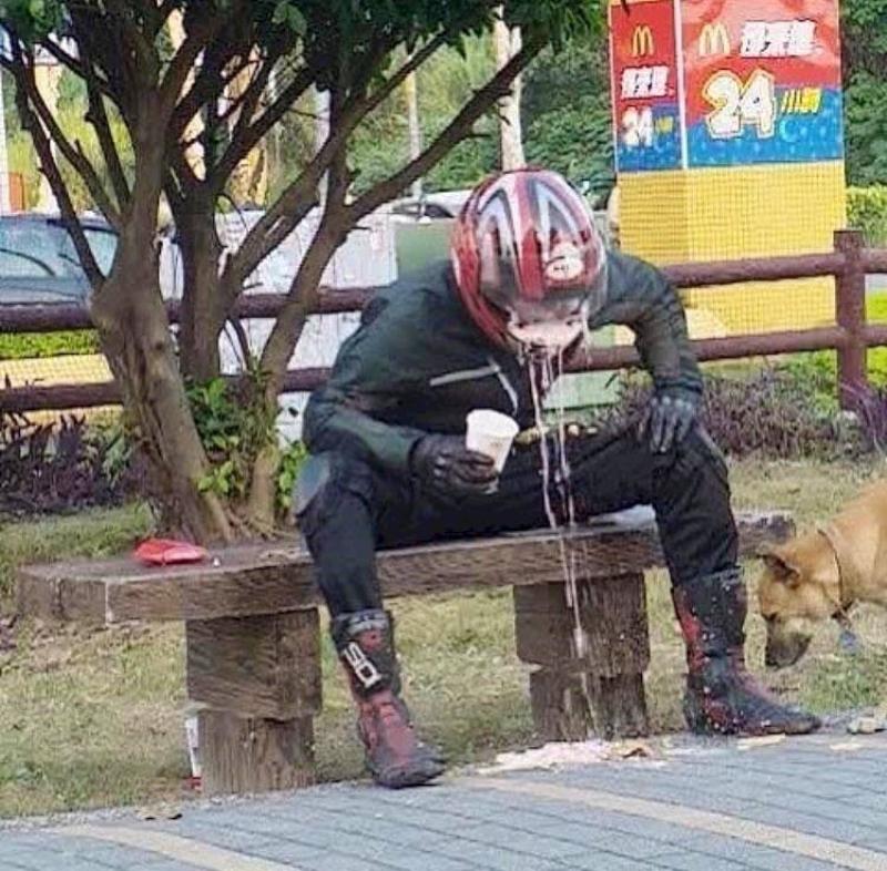 smart guy person attempted to drink a milkshake while wearing motorcycle helmet, and it's a mess