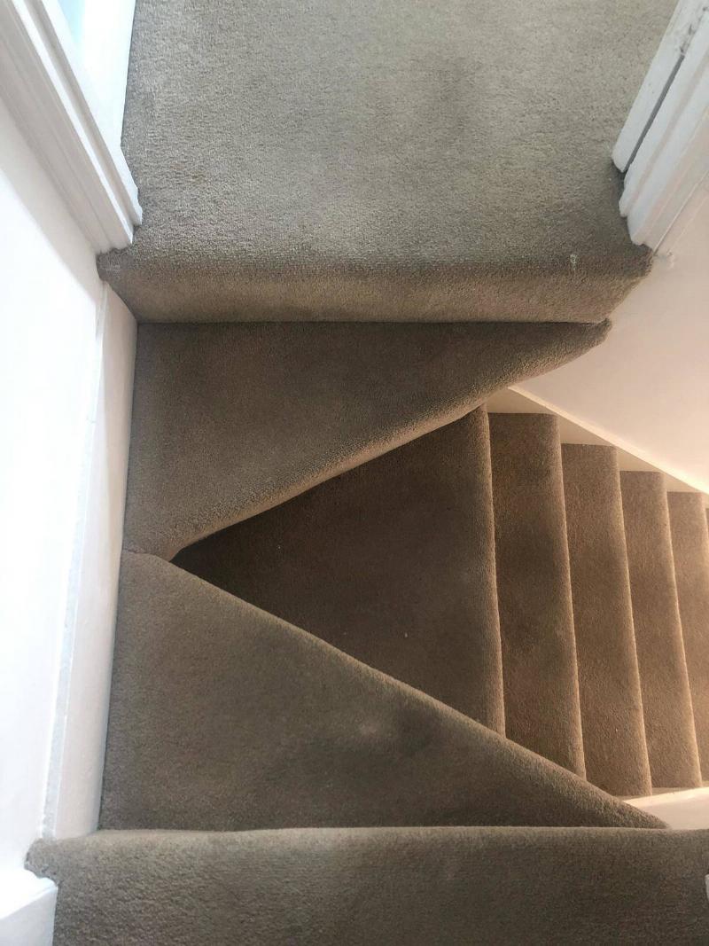 staircase made out of carpet and with a hole