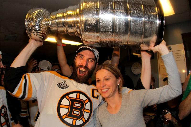 Zdeno and Tatiana hold up the Stanley Cup.