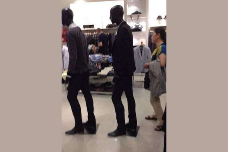 woman behind models woman stands behind mannequins