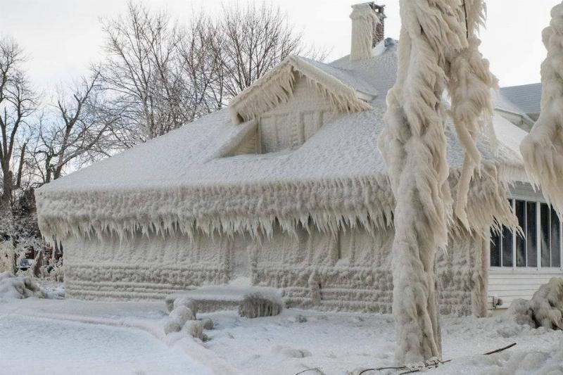 frozen home is covered in ice