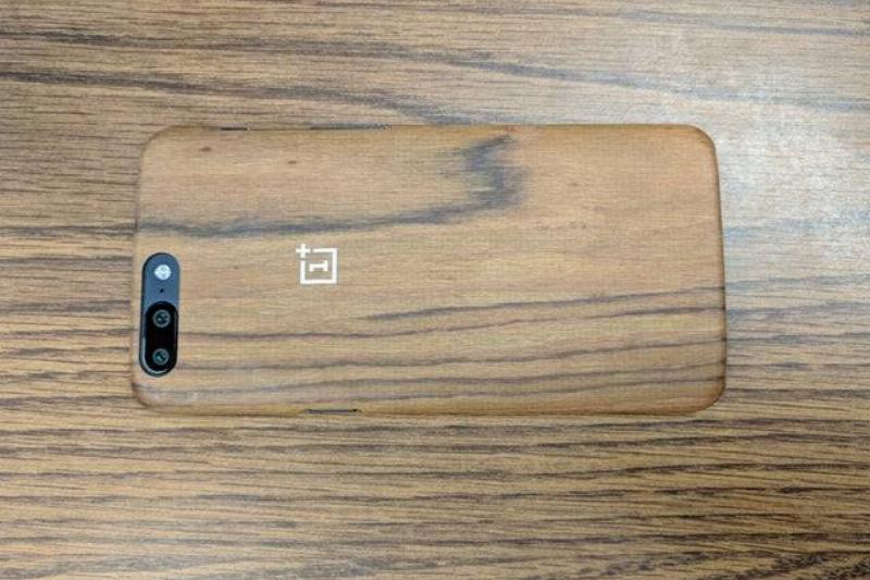 iamnothris Reddit phone on wood surface in wood-style phone case