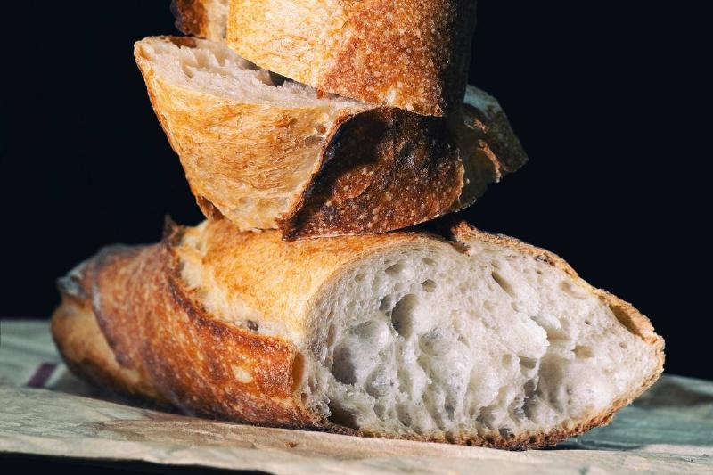 stacked bread Slices of French bread are stacked on top of each other.