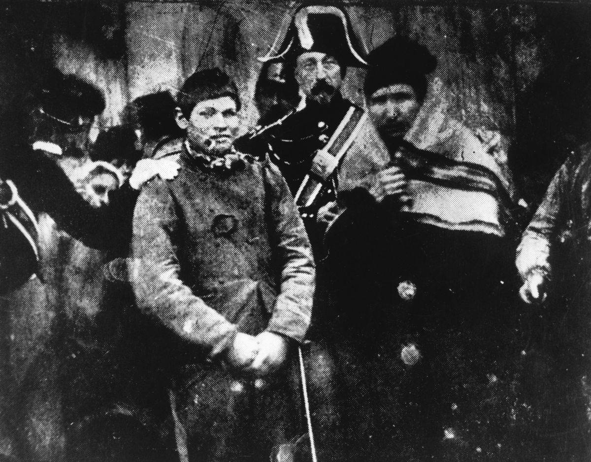 The first photo taken for the news shows a man being arrested in France.