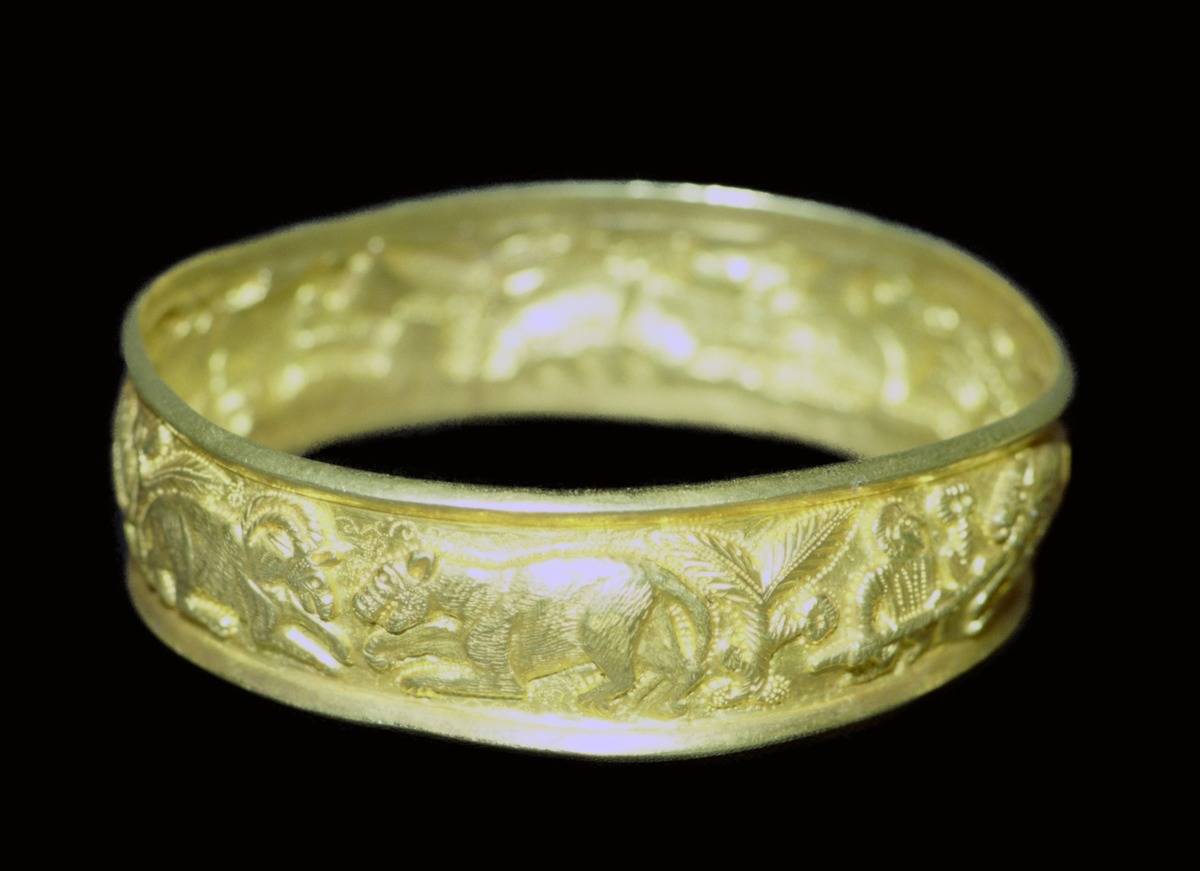 A golden bracelet from the Hoxne Hoard is on display.