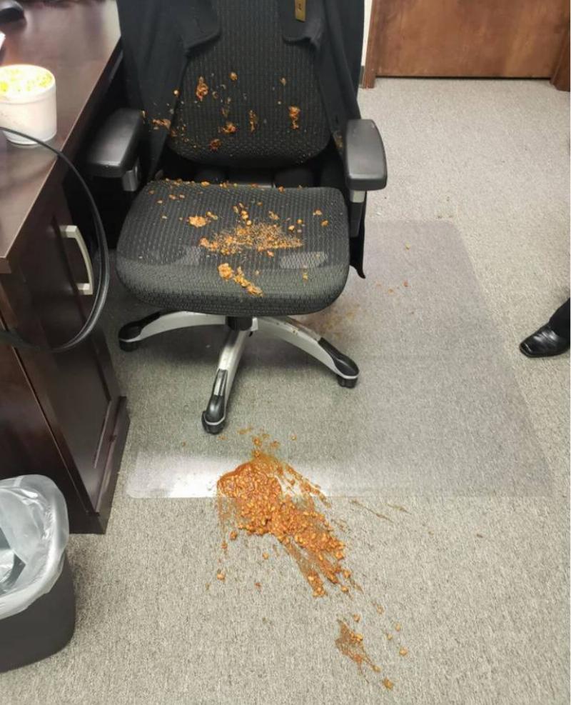 chilli chilli spilled all over office chair and floor beside it