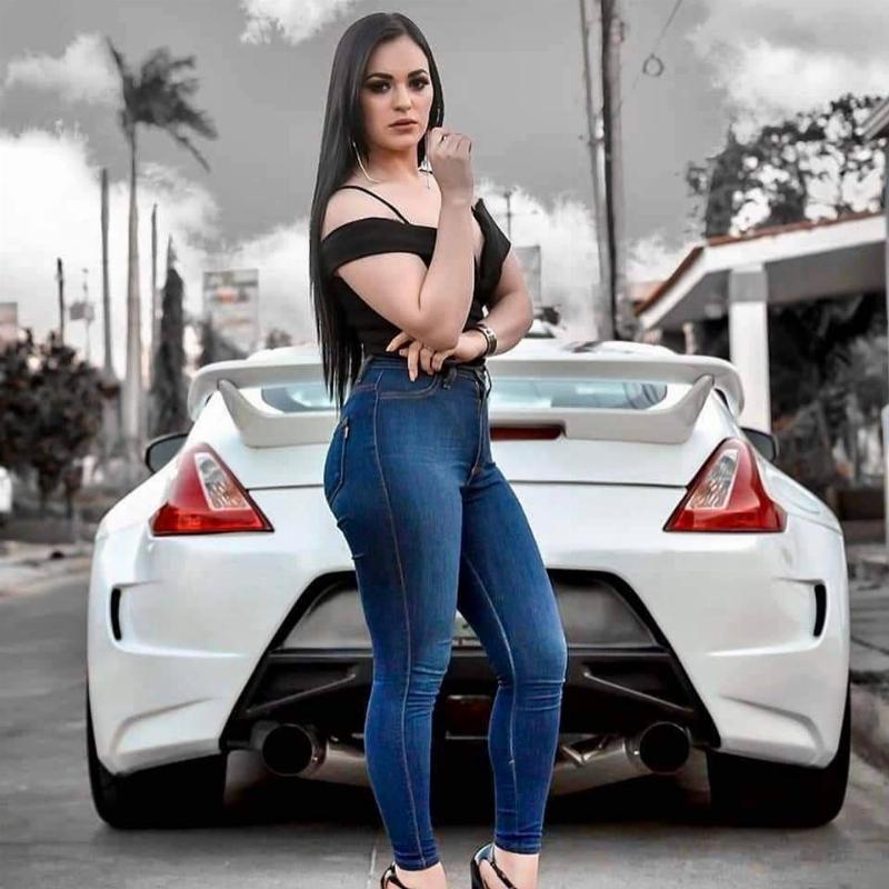 Woman in front of Nissan portrait shot Woman in front of Nissan 370Z Nismo portrait shot