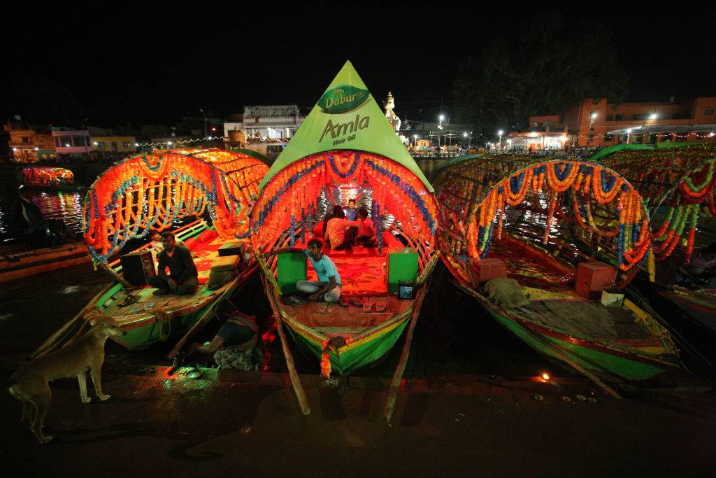 indian boatmen wait for customers in their boats in Chitrakoot, India