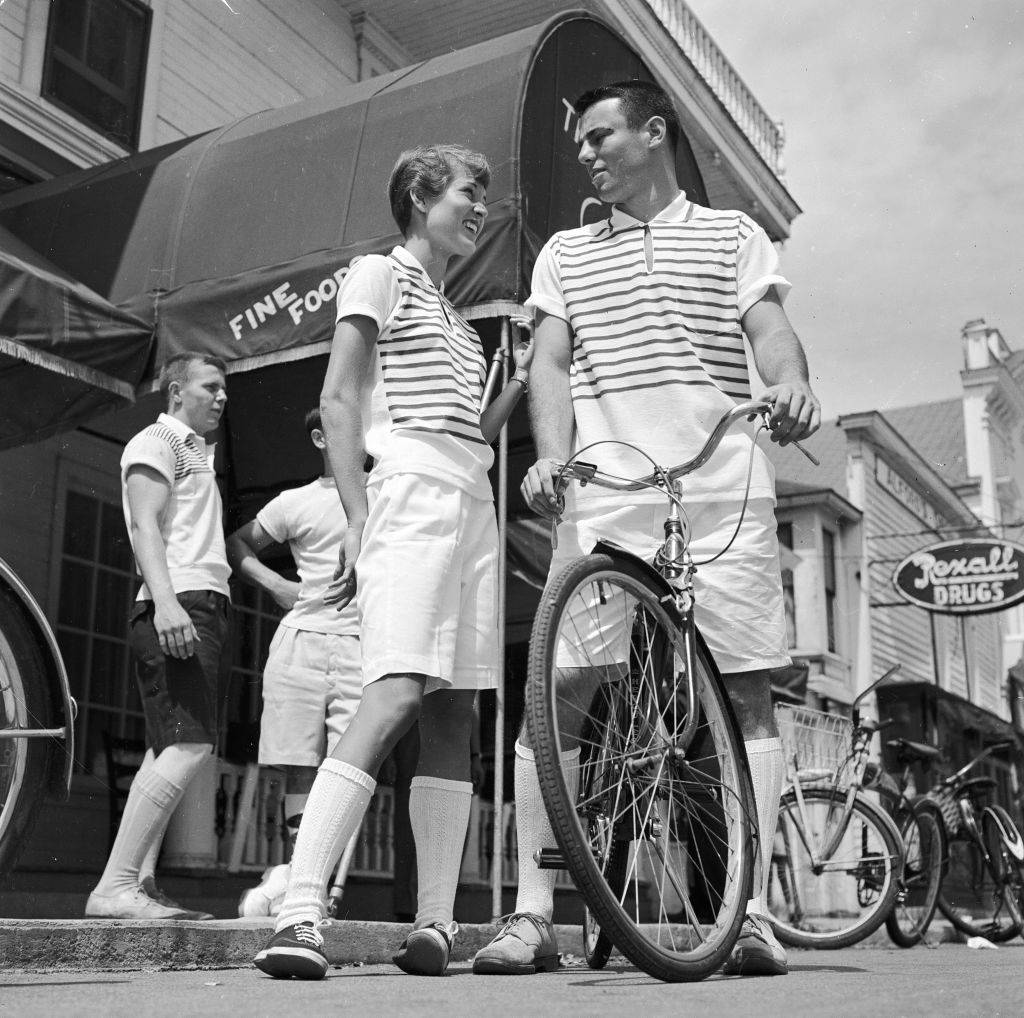 A couple in summer clothes talking on Mackinac Island, MIchigan in 1955