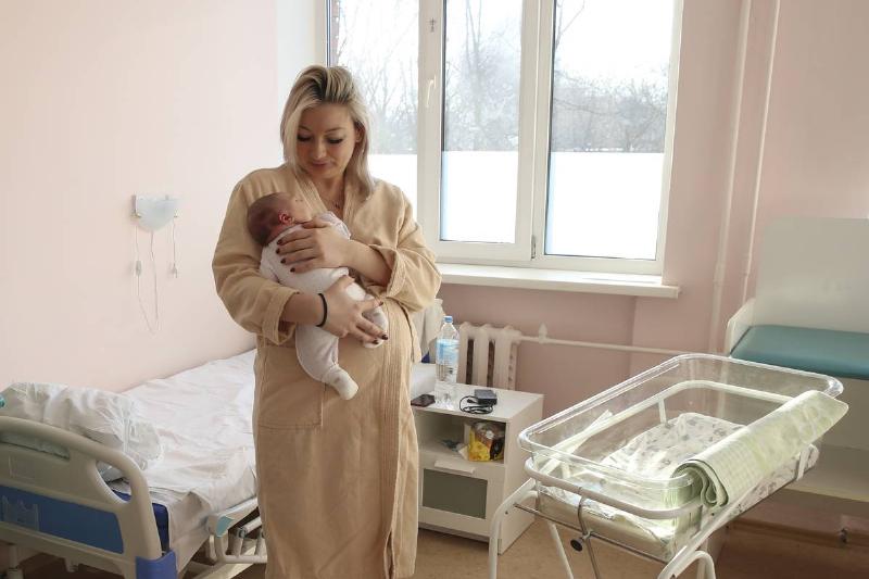 A woman holds a newborn at the maternity ward at the Khimki hospital.