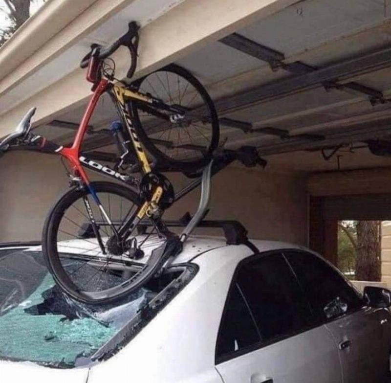bike mounted on car crushed by garage door