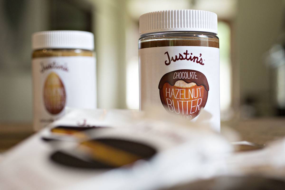 Containers hold hazelnut chocolate butter.