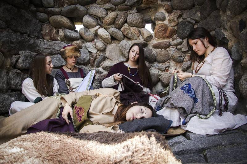 Women embroidering in a Viking village...