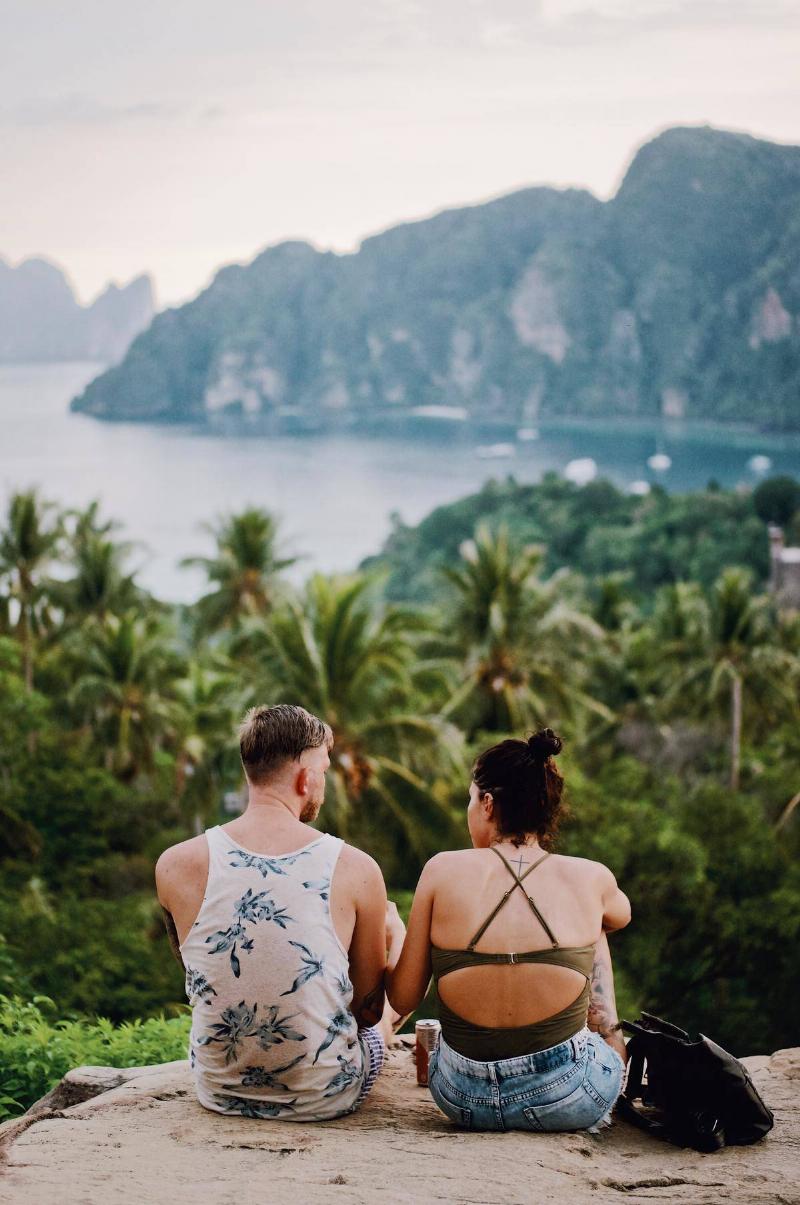 Couple sits at overlook on hike