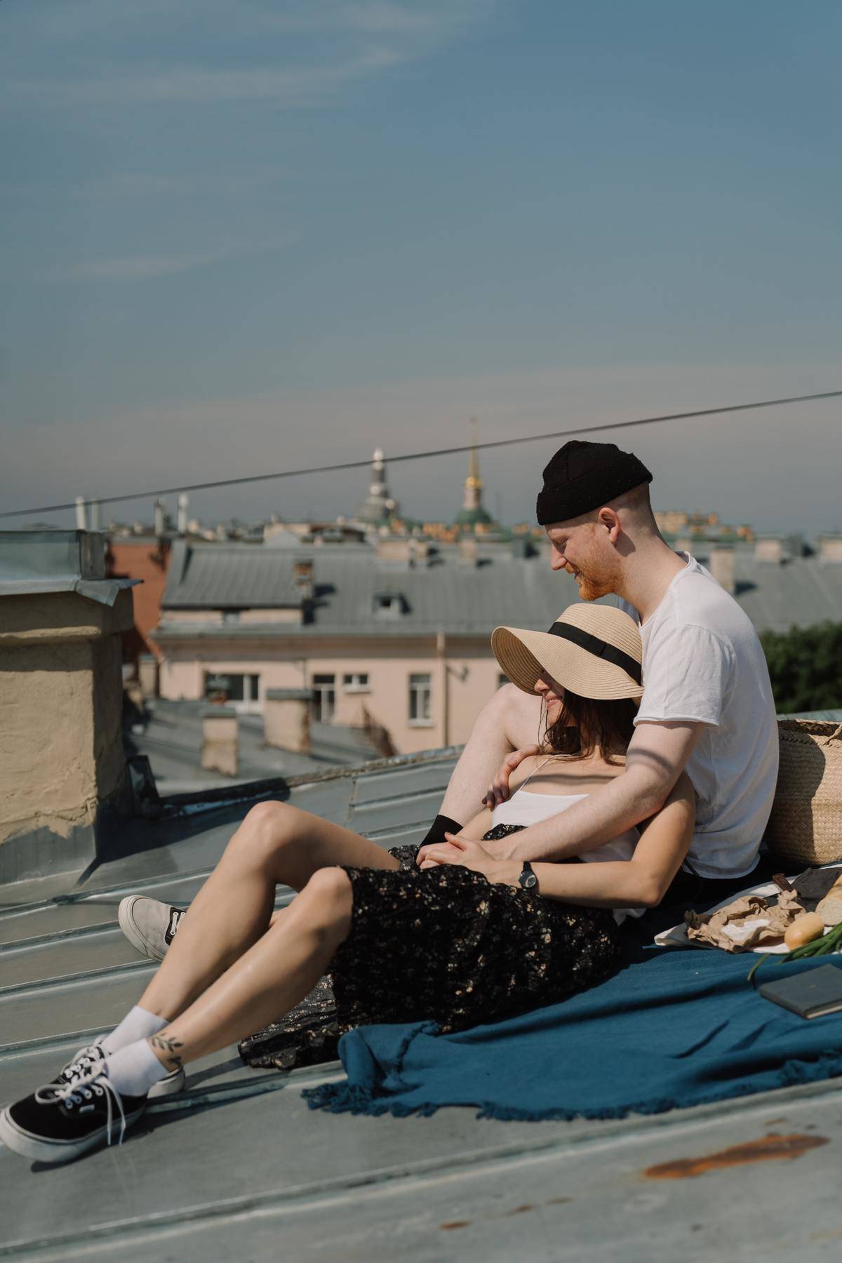 Couple lounges on rooftop