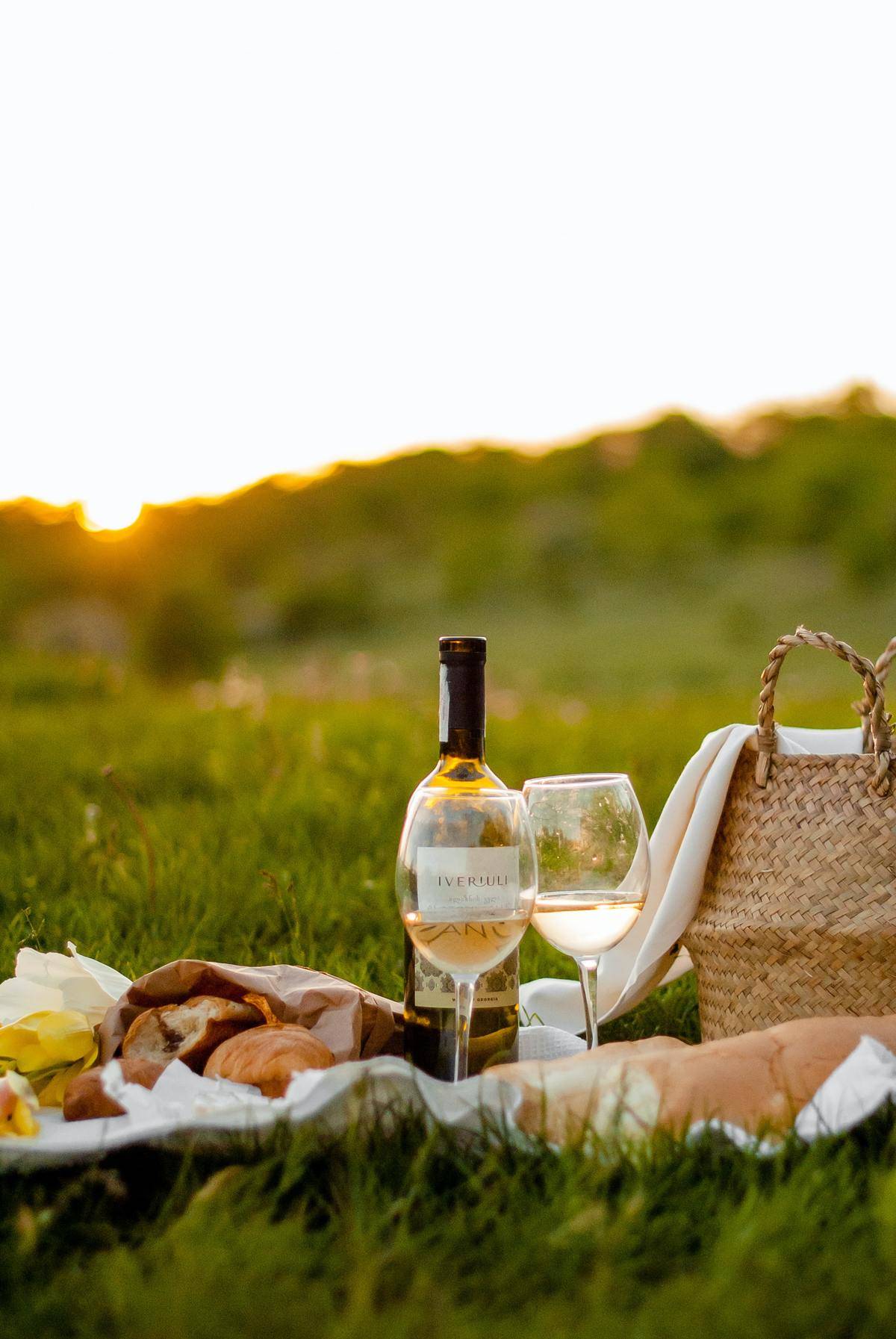 Wine glasses and picnic basket