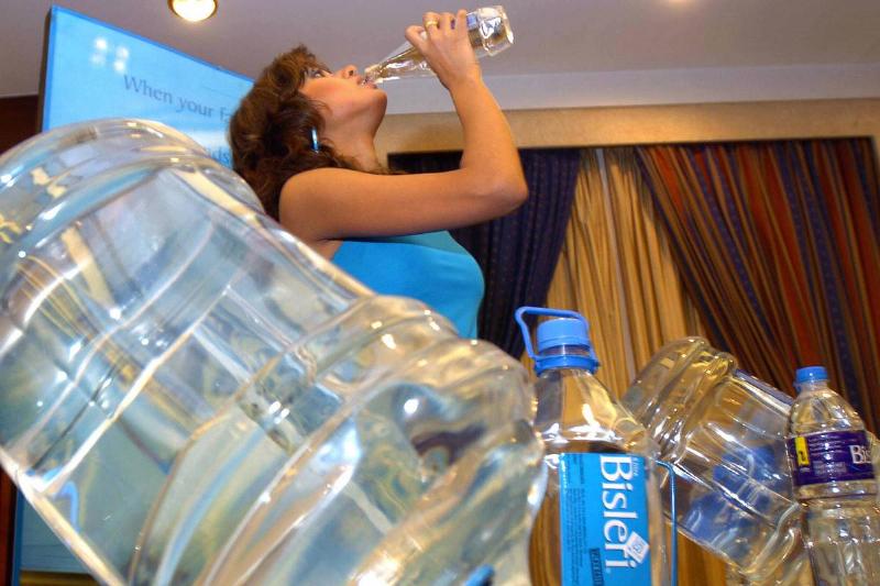 An Indian model drinks bottled drinking An Indian model drinks bottled drinking