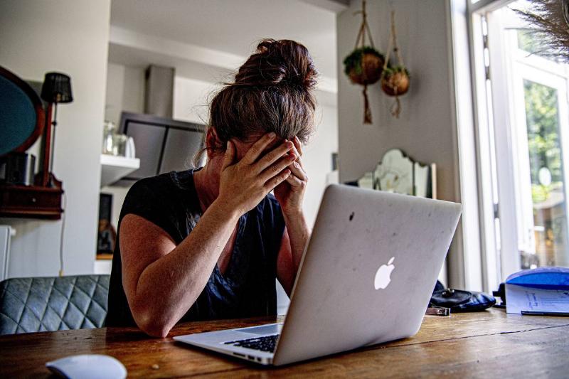 In this photo illustration a woman appears to be stressed as... In this photo illustration a woman appears to be stressed as...