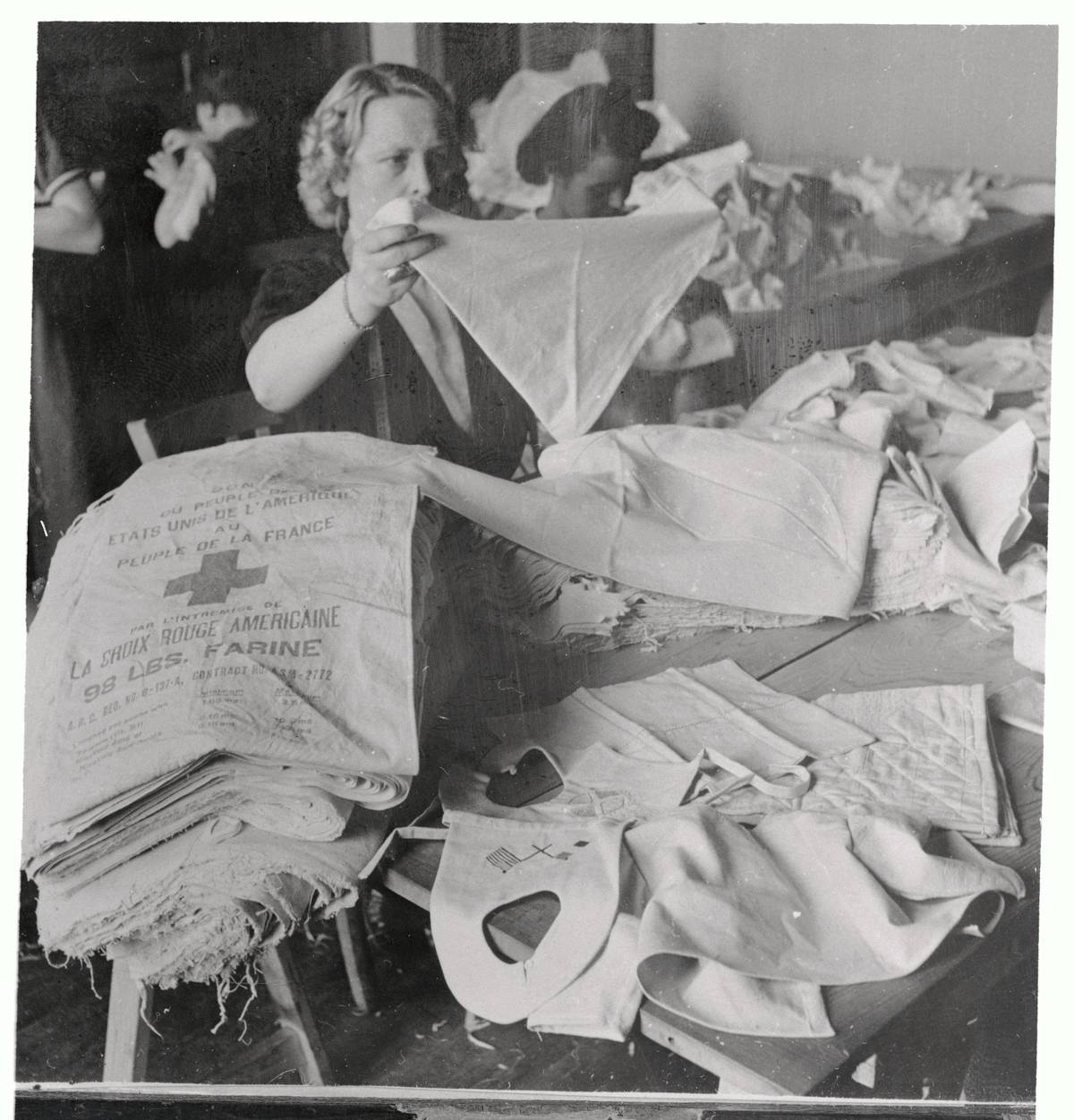 Relief Worker Making Diapers from Flour Sacks