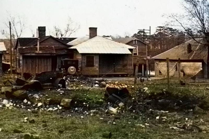 impoverished farm Dilapidated farm homes are surrounded with debris.