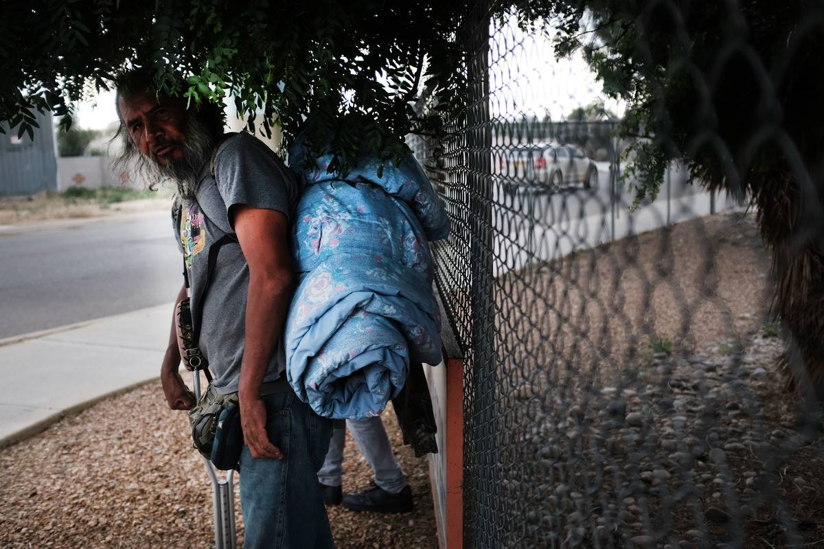 impoverished new mexico A homeless man walks with his belongings in New Mexico.