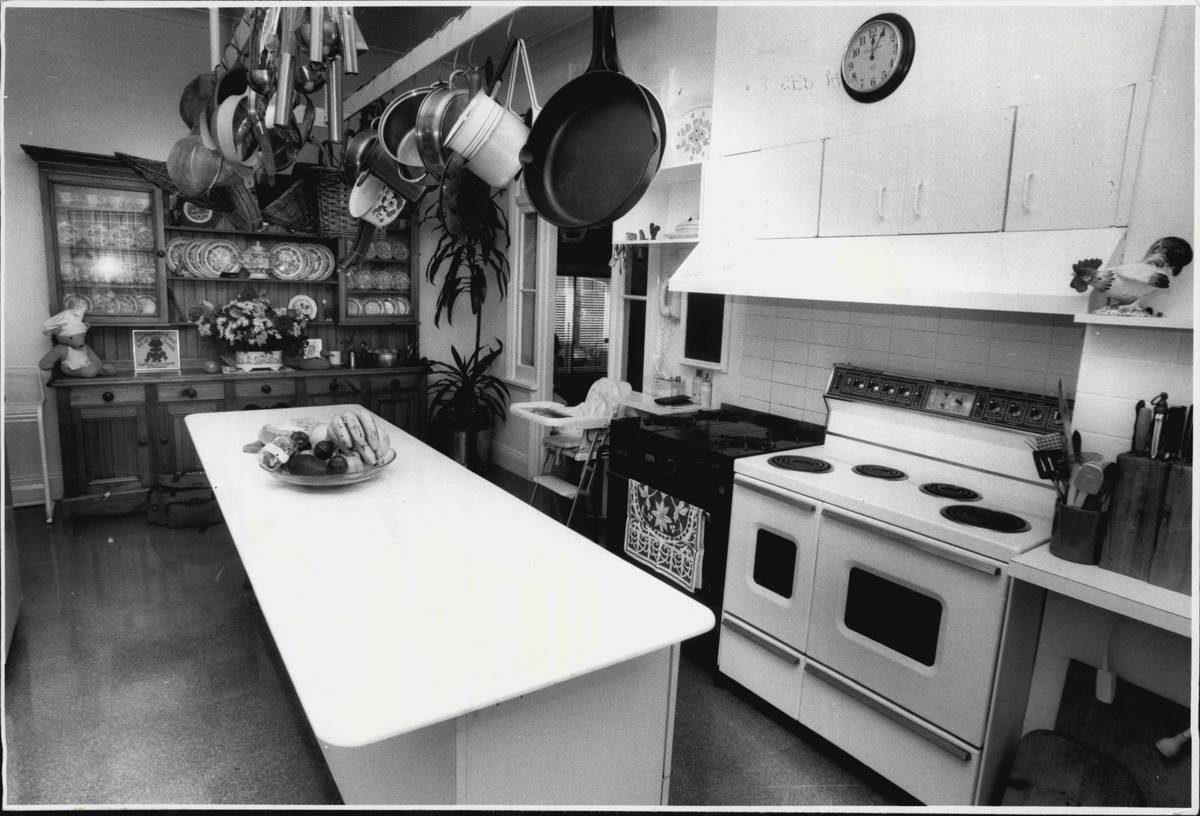 A large, long kitchen island is seen in this 1987 kitchen.