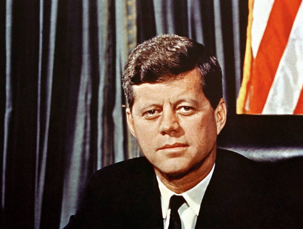 The 35th U.S. president sits in the Oval Office in the White House, 1961.