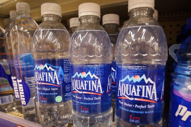 aquafina 75817758 Bottle of Pepsi's Aquafina water sits on a shelf