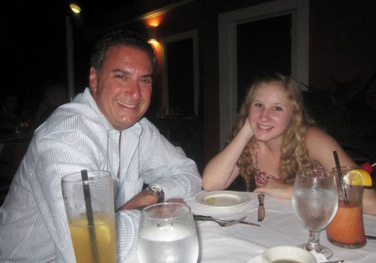 Joe is photographed eating dinner with his daughter, Rebecca.