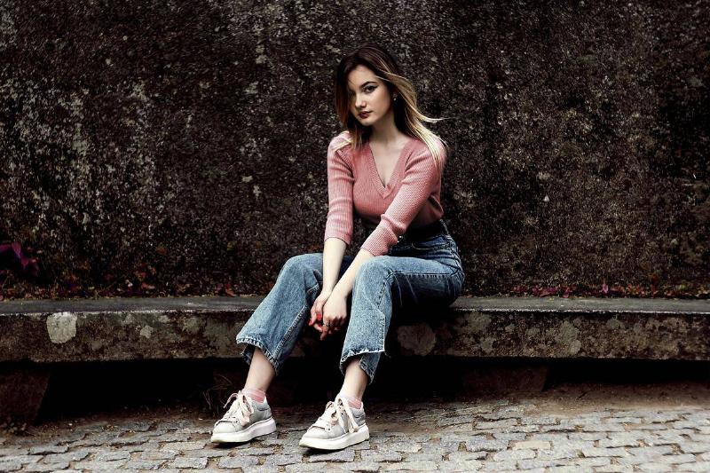 straight legs a girl sitting outside