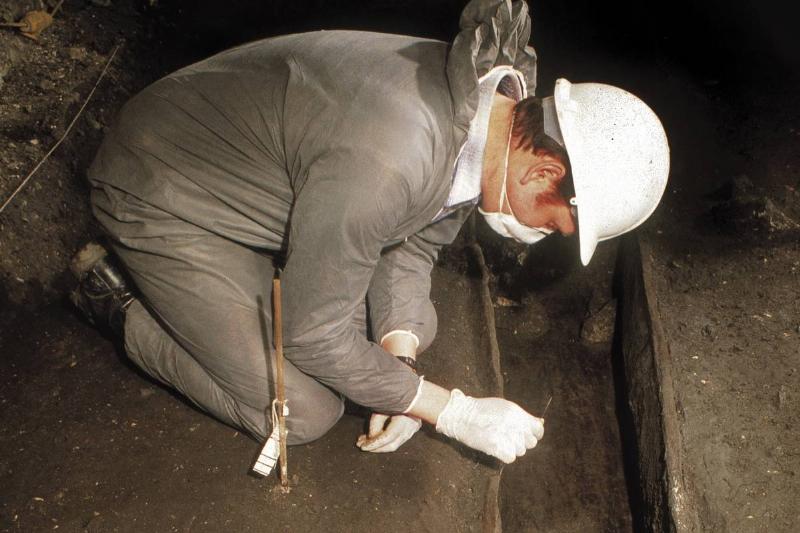 archaeologist digging An archaeologist excavates in 1992.