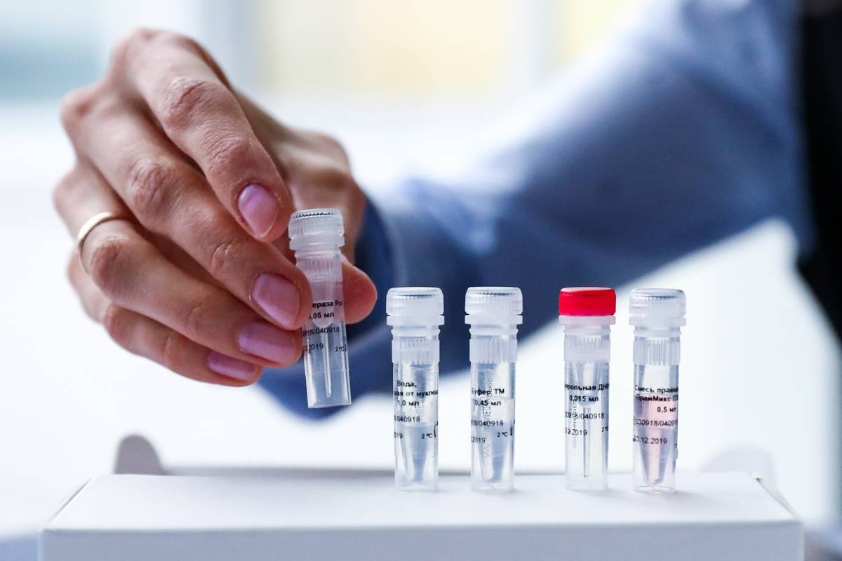 forensic dna A researcher picks up a vial of DNA for forensic testing.