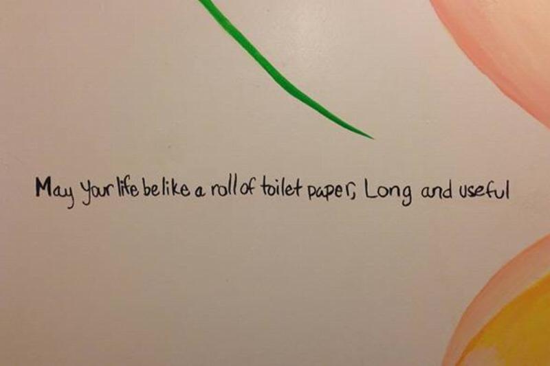 Public bathroom graffiti: may your life be like a roll of toilet paper, long and useful